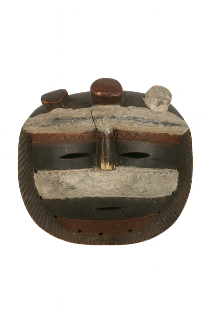 Wooden mask with a neutral expression on a white background