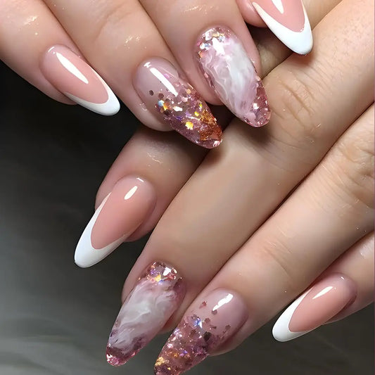 Close-up of hands with pink and white nail polish on a dark background