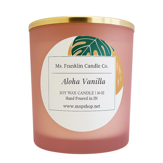 A pink frosted glass soy wax candle labeled 'Aloha Vanilla' by Ms. Franklin Candle Co., featuring a tropical leaf design and gold lid, isolated on a transparent background