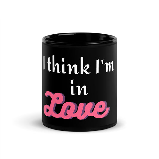 black ceramic coffee and tea mug with phrase i think im in love